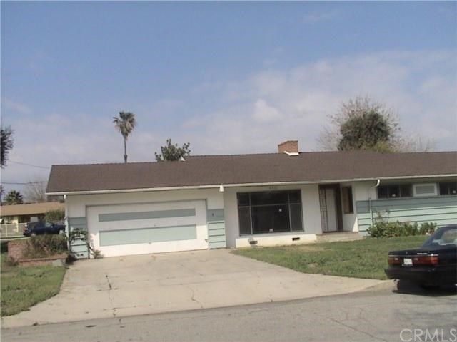 440 East Victoria Street Rialto, CA 92376 - Photo 1 of 1 a front view of a house with a garden and yard