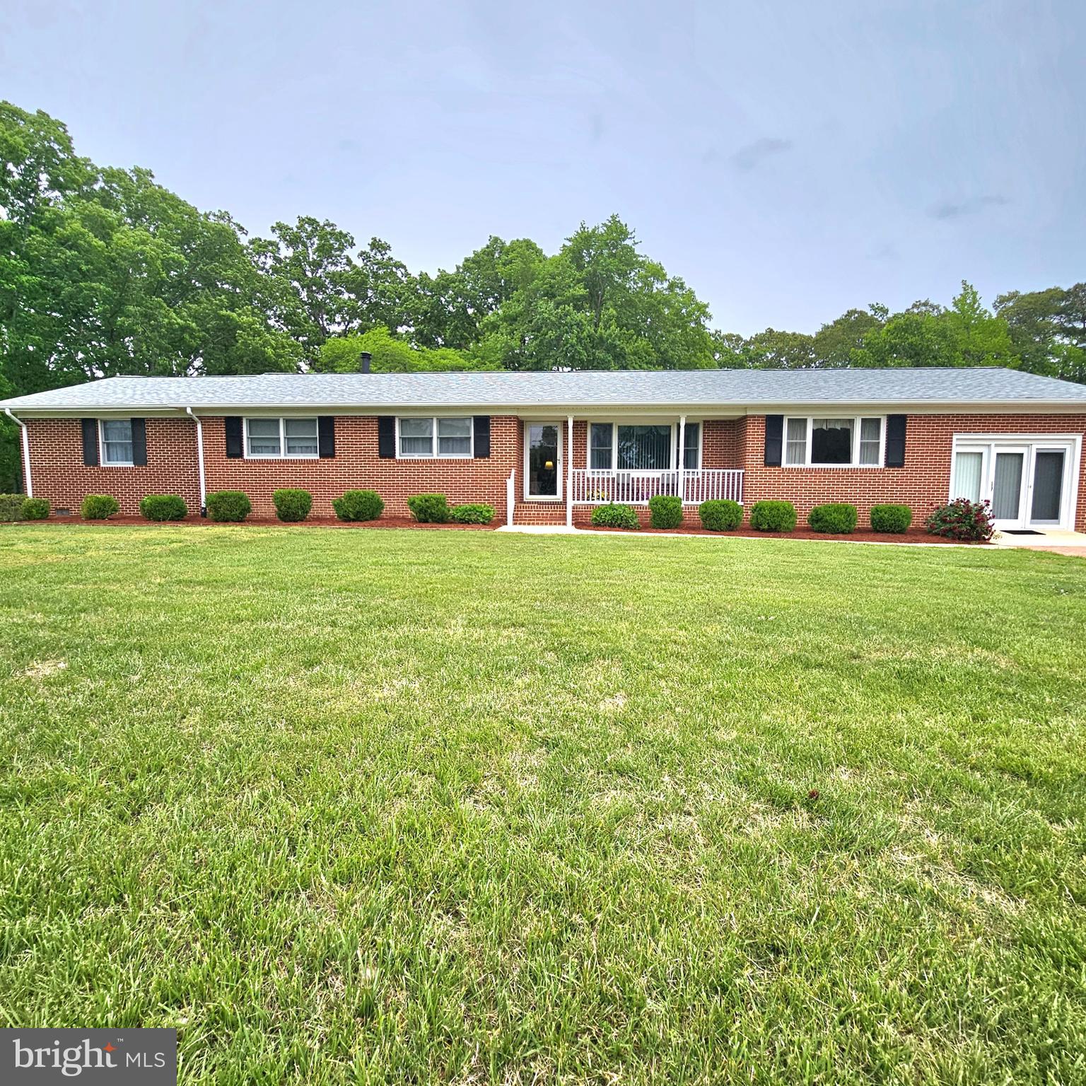 20098 Piney Point Road Callaway, MD 20620 - Photo 1 of 67 a front view of a house with a garden