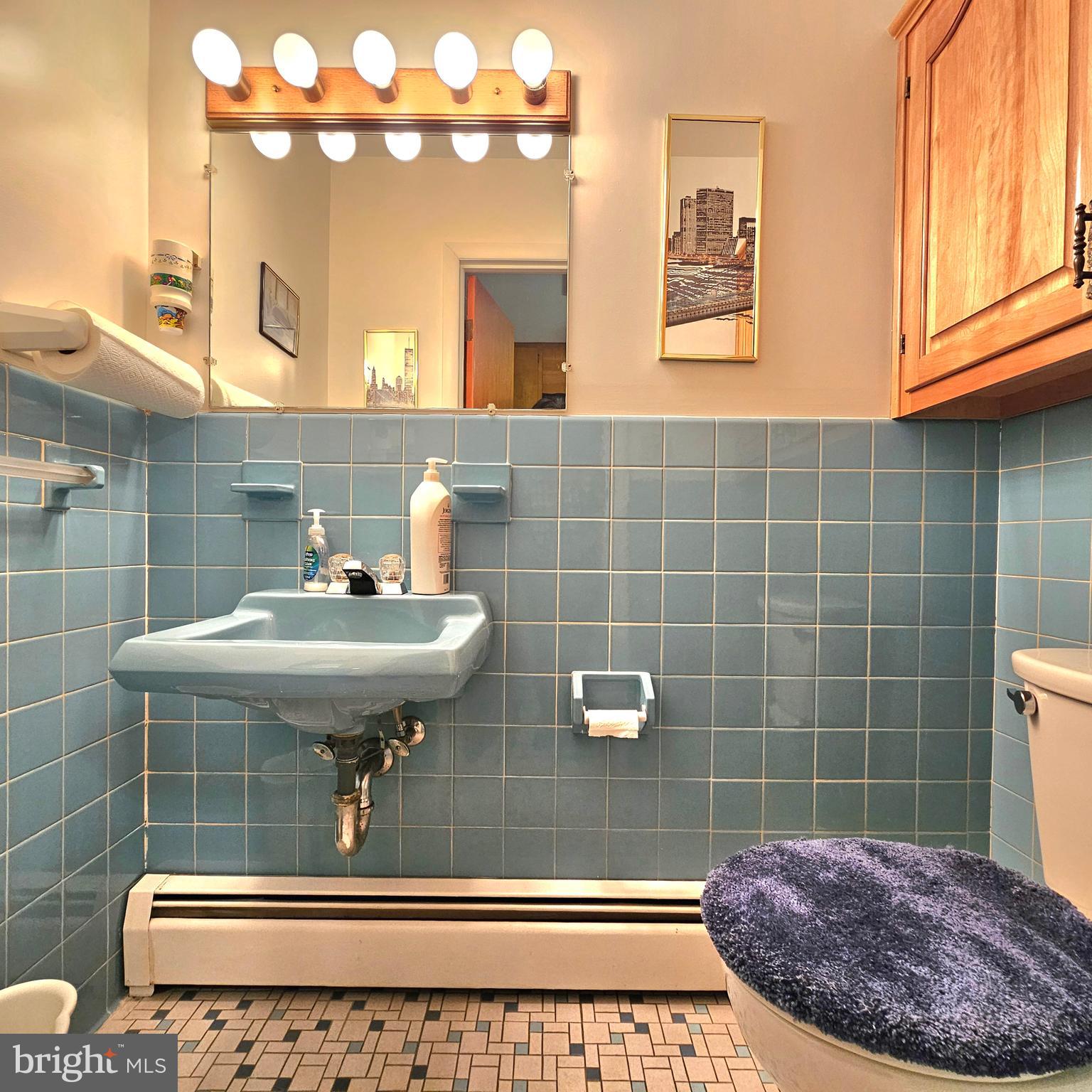 20098 Piney Point Road Callaway, MD 20620 - Photo 21 of 67 a bathroom with a sink a mirror and a shower