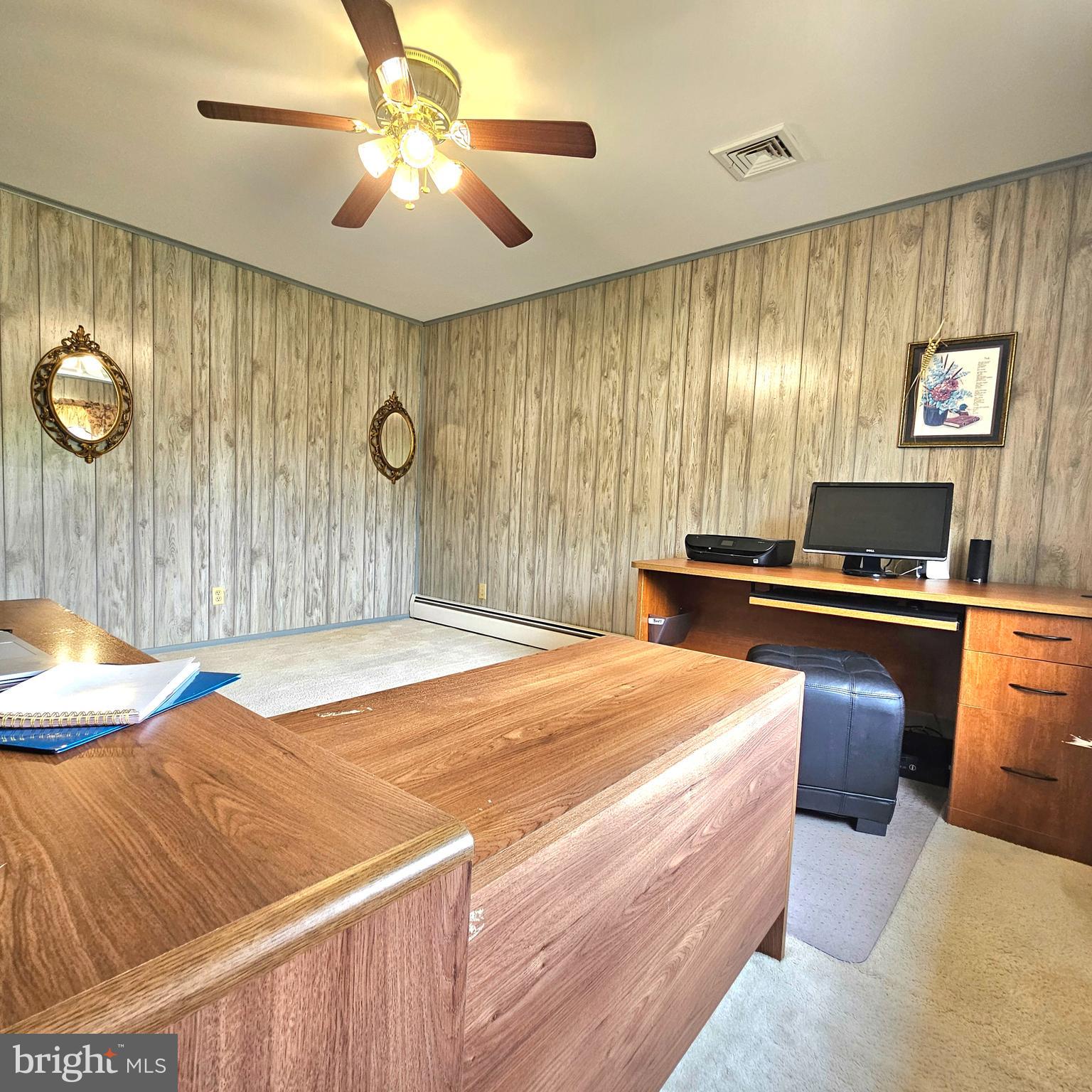 20098 Piney Point Road Callaway, MD 20620 - Photo 23 of 67 a bedroom with a bed and a chandelier