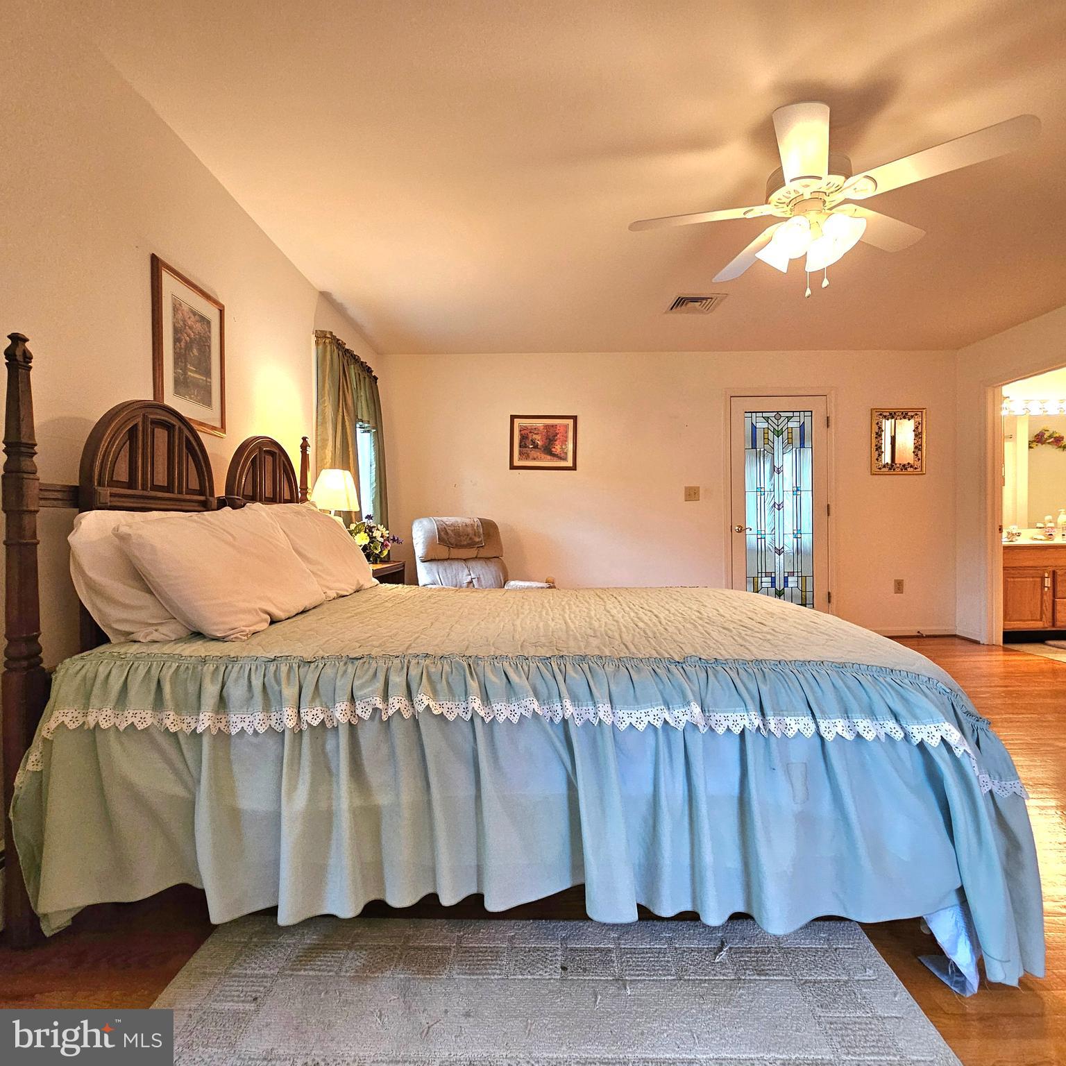 20098 Piney Point Road Callaway, MD 20620 - Photo 32 of 67 a bedroom with a bed and lamp