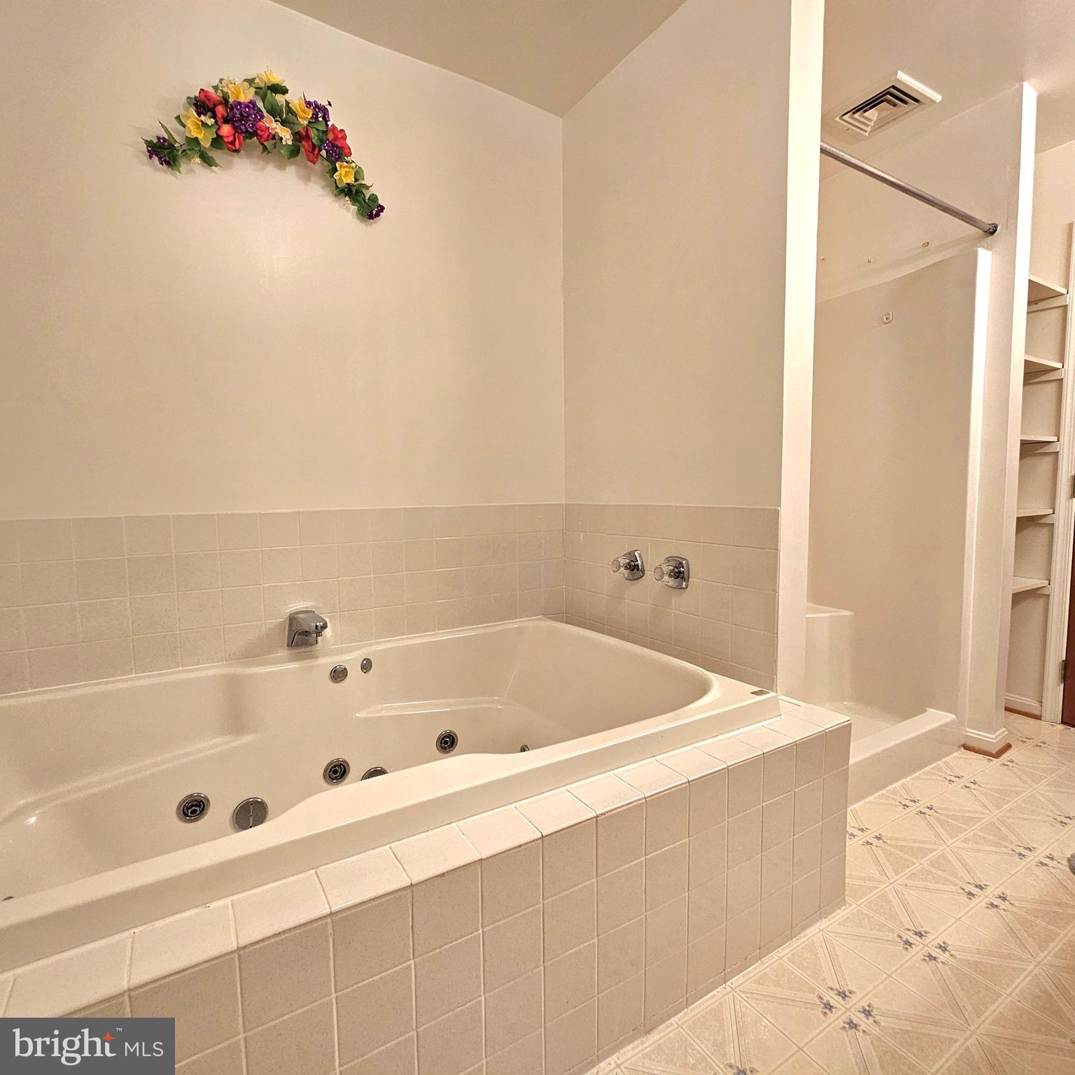20098 Piney Point Road Callaway, MD 20620 - Photo 37 of 67 a bathroom with a tub a sink and a shower