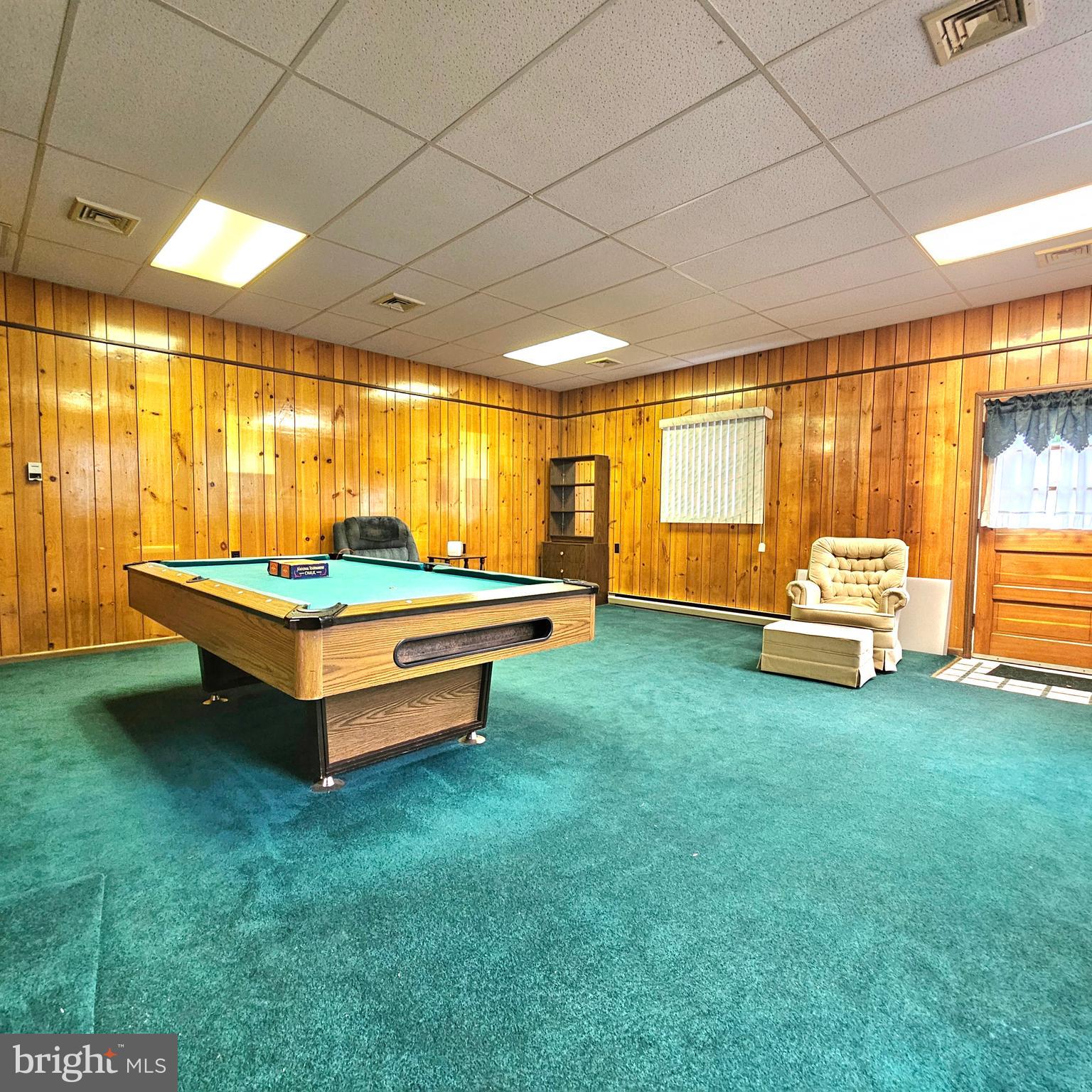 20098 Piney Point Road Callaway, MD 20620 - Photo 48 of 67 a backyard with pool table and sofas