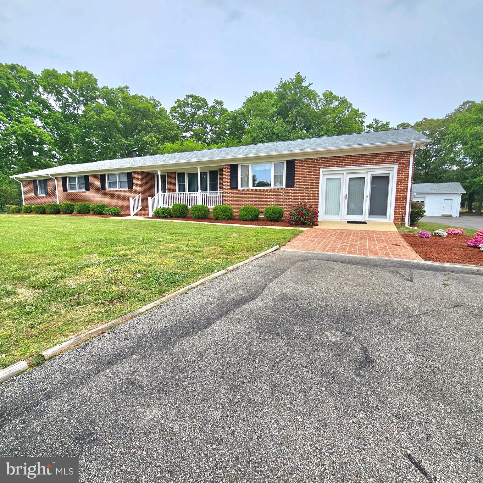 20098 Piney Point Road Callaway, MD 20620 - Photo 56 of 67 a front view of a house with a garden