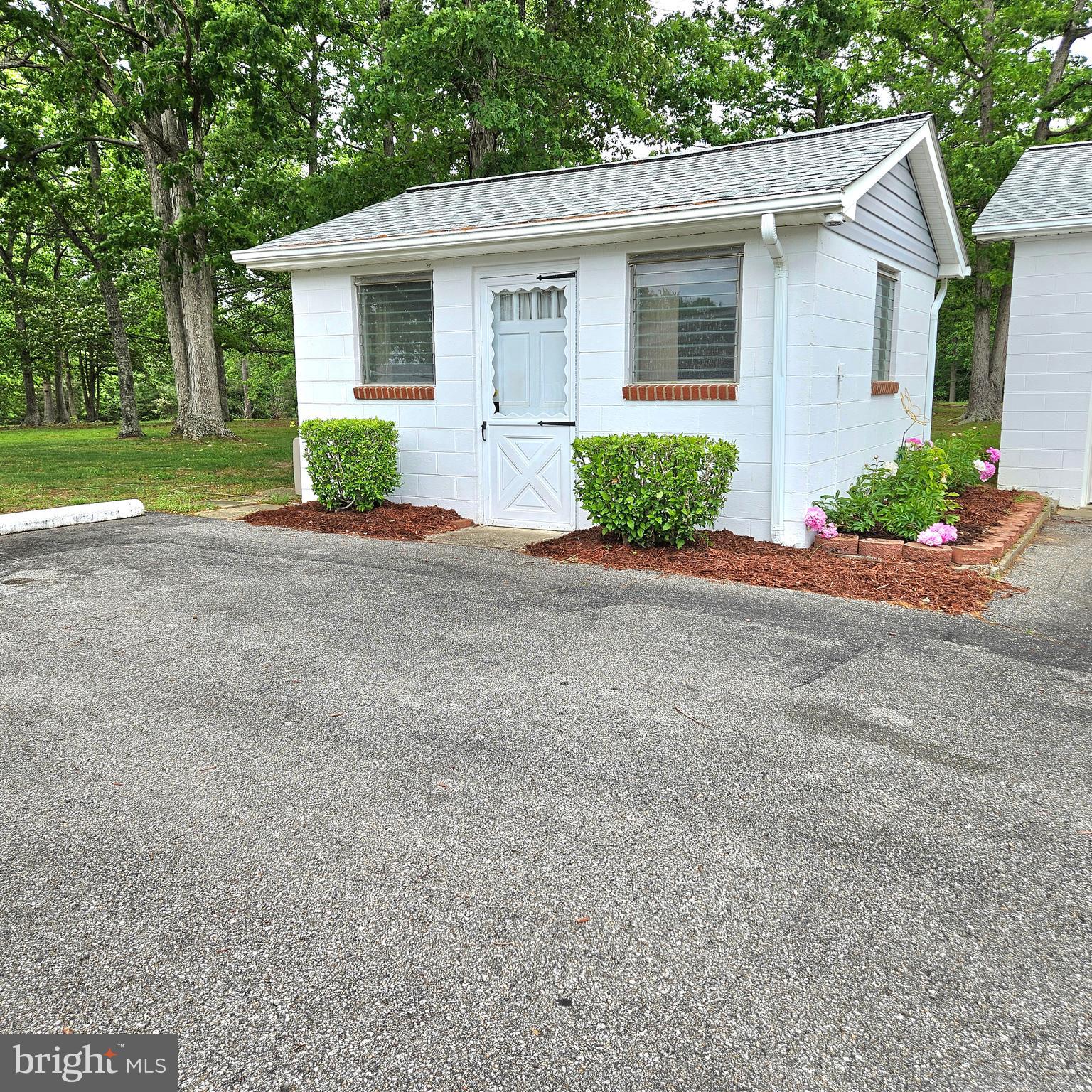 20098 Piney Point Road Callaway, MD 20620 - Photo 62 of 67 a front view of a house with garden