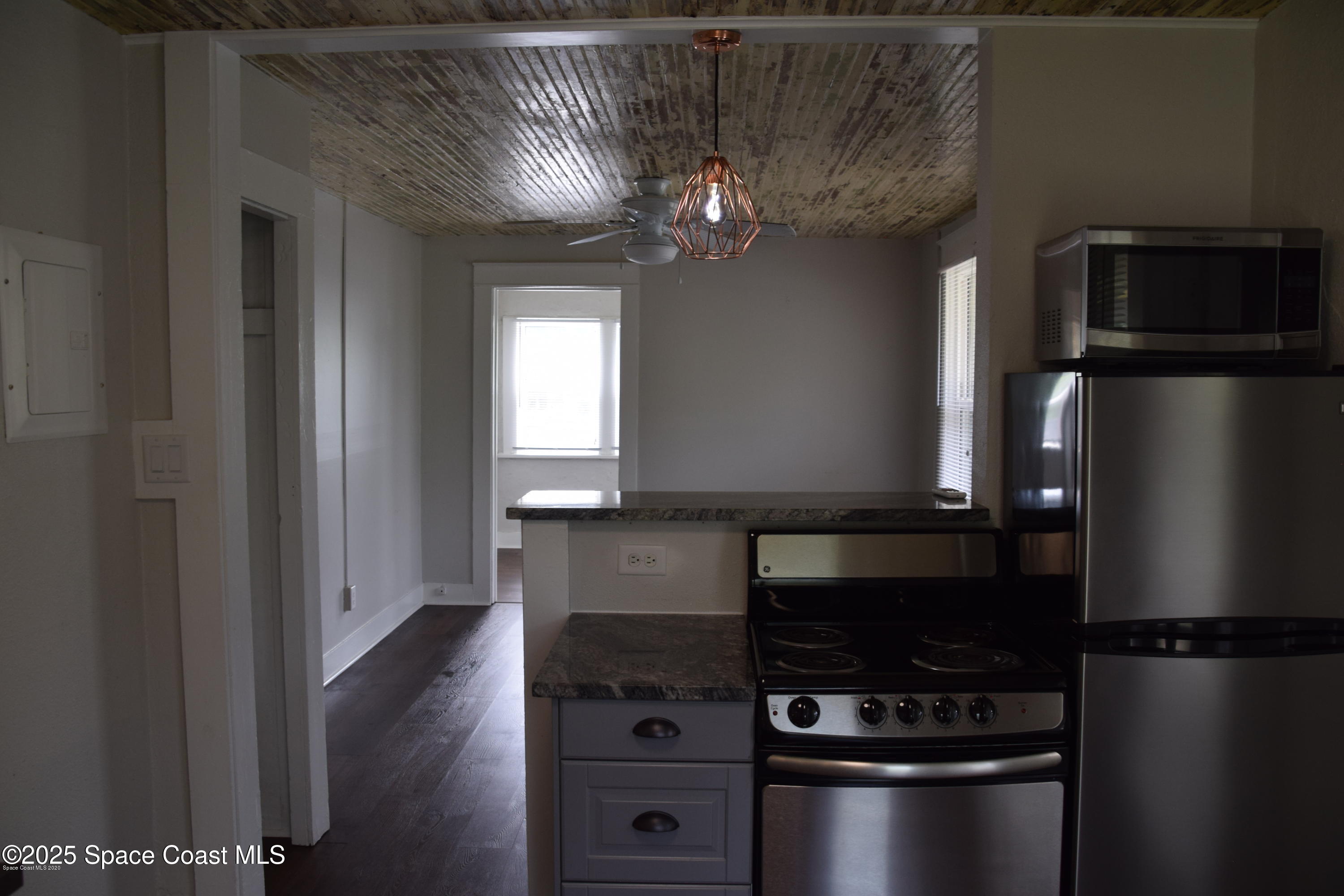 2100 Franklin Street, Unit 3 Melbourne, FL 32901 - Photo 13 of 22 a kitchen with appliances a counter space and cabinets