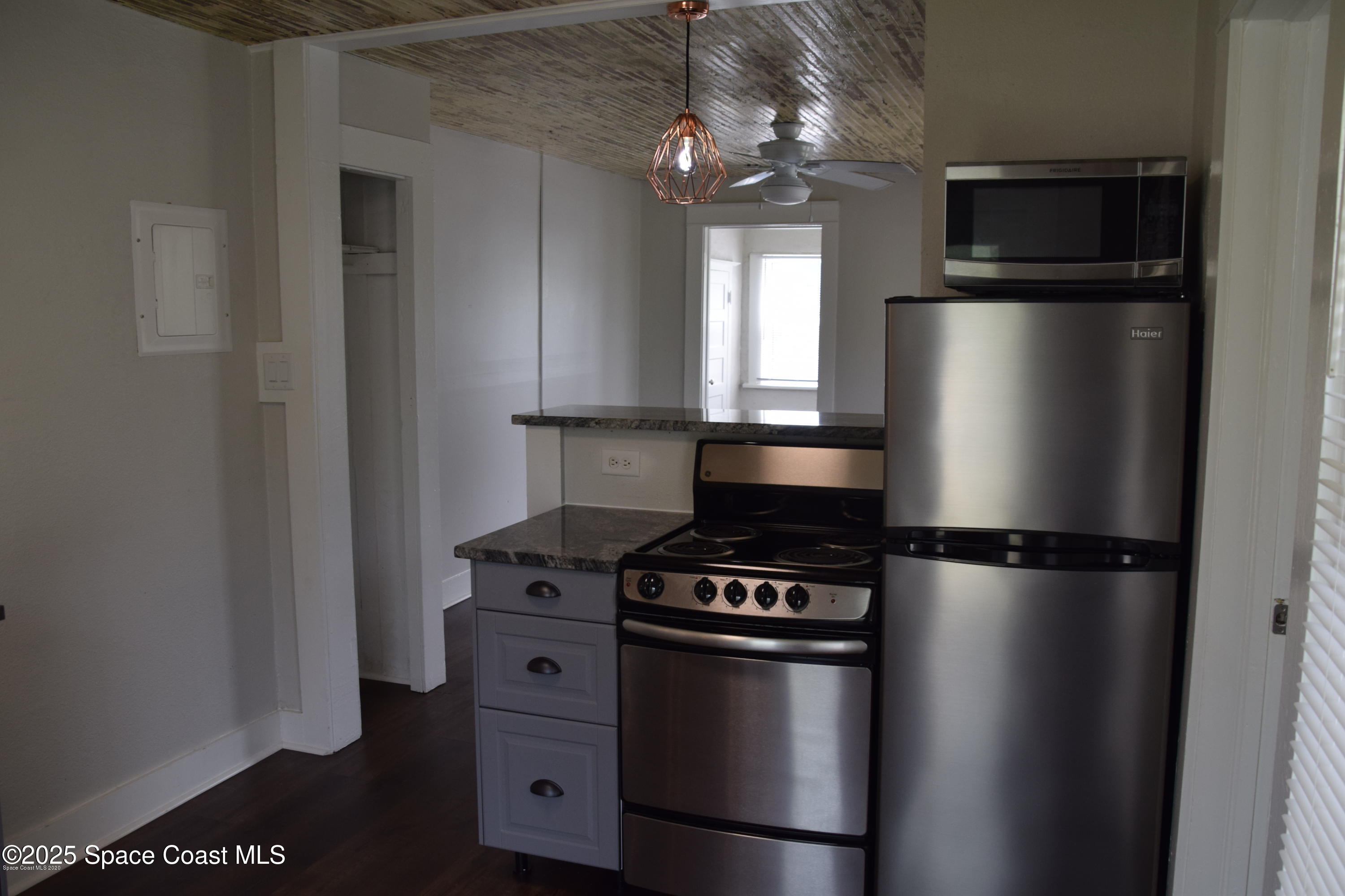 2100 Franklin Street, Unit 3 Melbourne, FL 32901 - Photo 14 of 22 a kitchen with a refrigerator stove and microwave