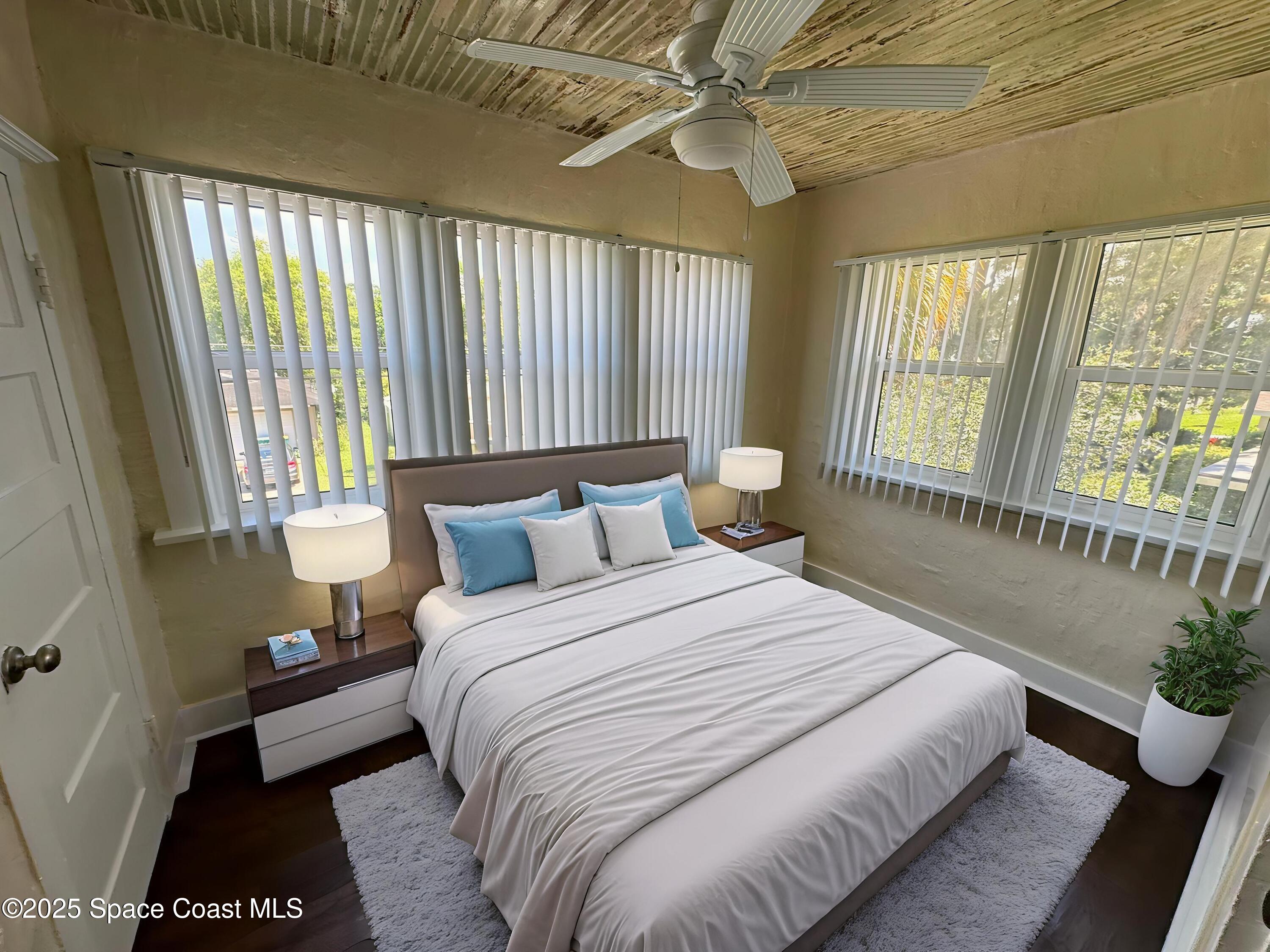 2100 Franklin Street, Unit 3 Melbourne, FL 32901 - Photo 6 of 22 a bedroom with a bed and a large window with outer view