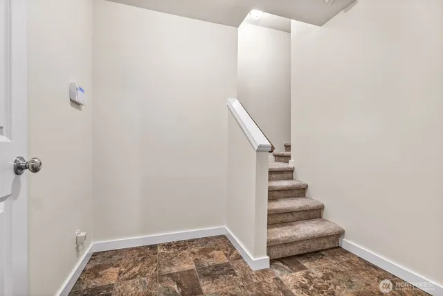 a view of entryway with stairs