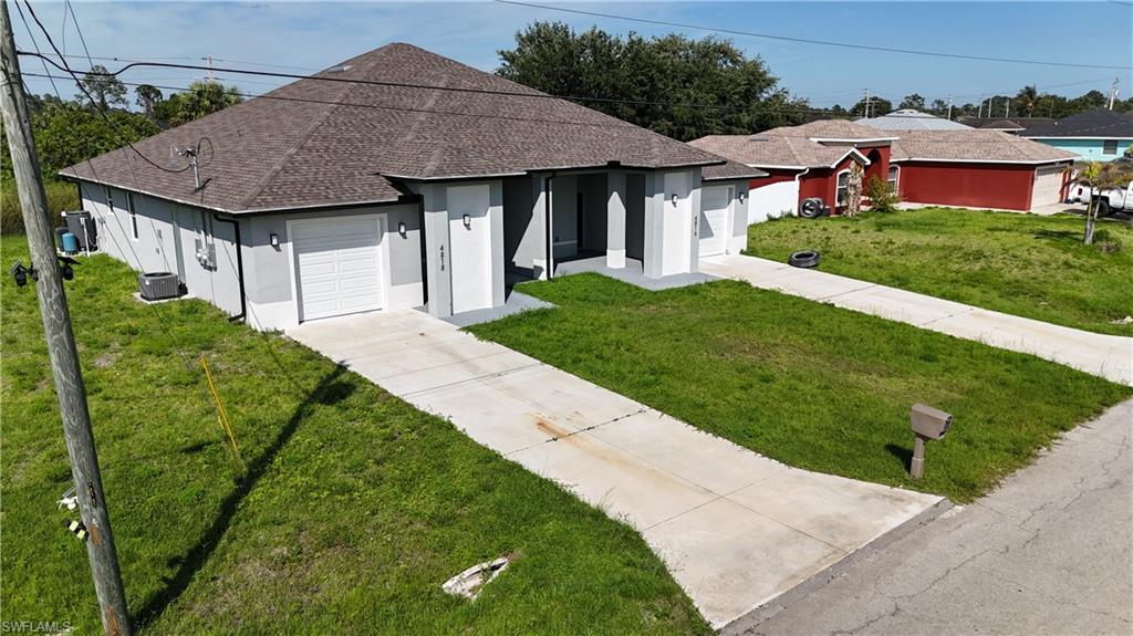 4816 24th Street Southwest Lehigh Acres, FL 33973 - Photo 30 of 32 a aerial view of a house with a yard plants and large tree