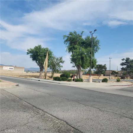 a view of a street with a building in the background