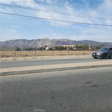 a view of a road with an ocean view