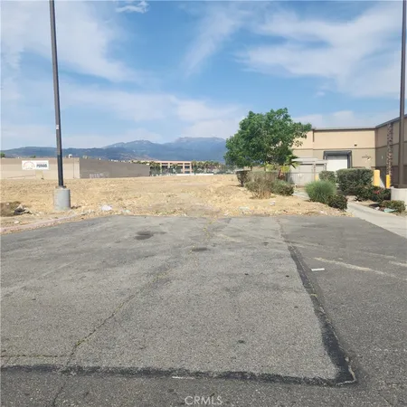 a view of a street with an ocean view