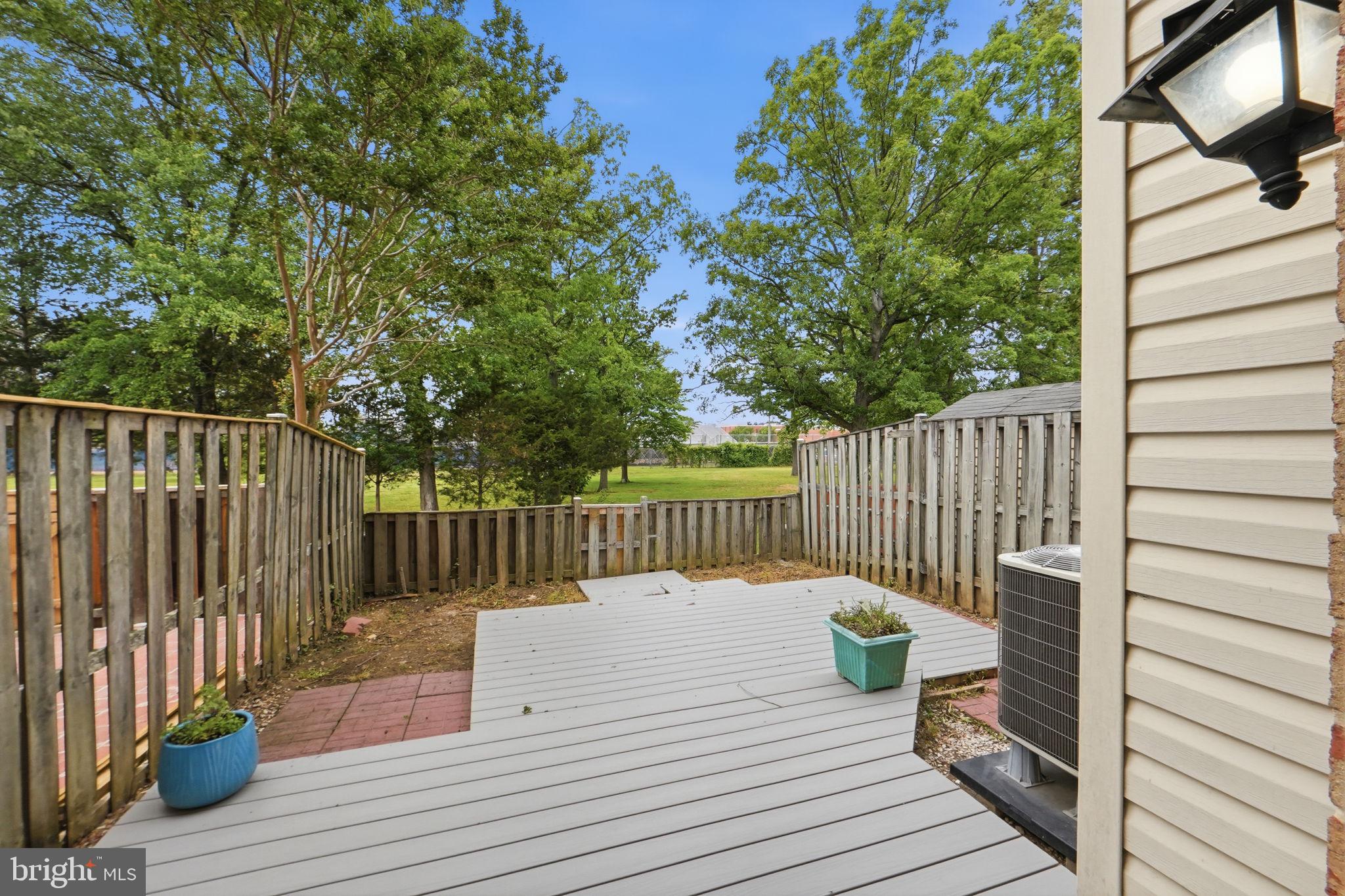6470 Franconia Court Springfield, VA 22150 - Photo 27 of 31 a view of a deck with wooden floor and fence with a pot