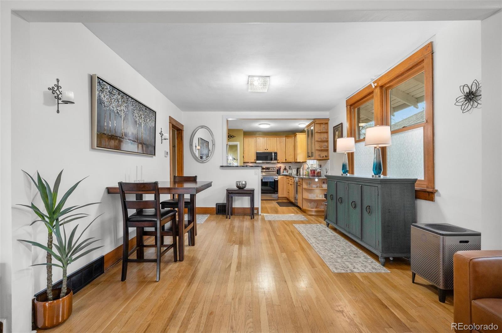 1136 Cook Street Denver, CO 80206 - Photo 11 of 42 a living room with furniture and wooden floor