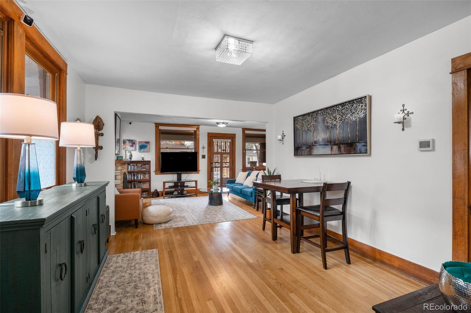 1136 Cook Street Denver, CO 80206 - Photo 12 of 42 a living room with furniture and a flat screen tv