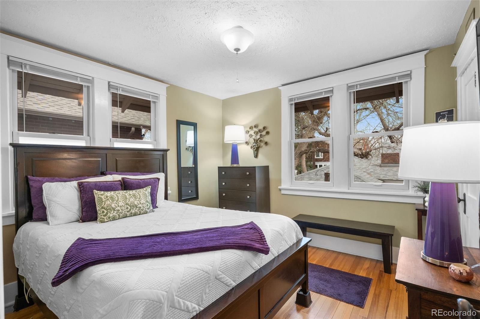 1136 Cook Street Denver, CO 80206 - Photo 16 of 42 a bedroom with a bed and a dresser