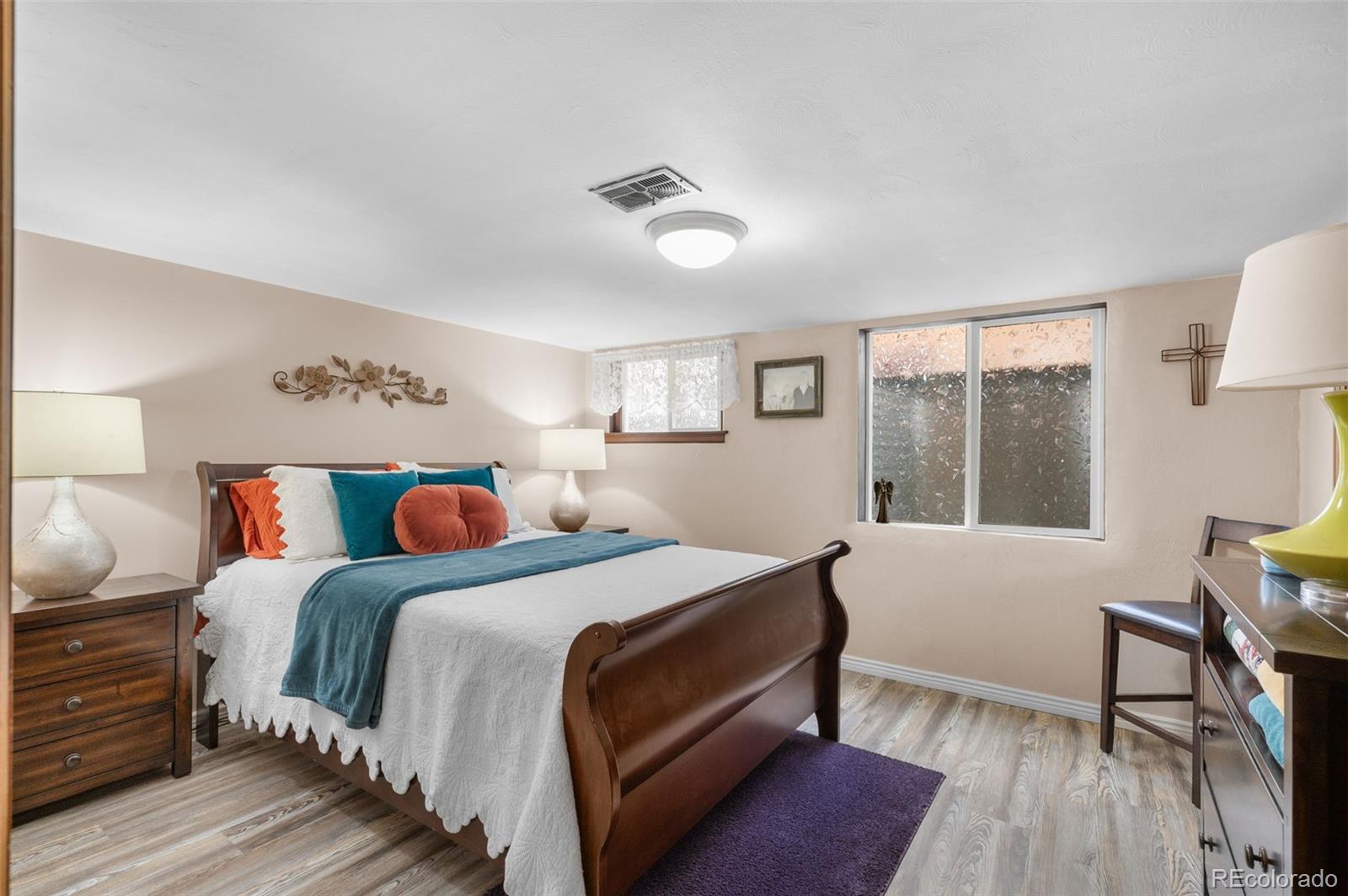 1136 Cook Street Denver, CO 80206 - Photo 24 of 42 a bedroom with a bed and a window