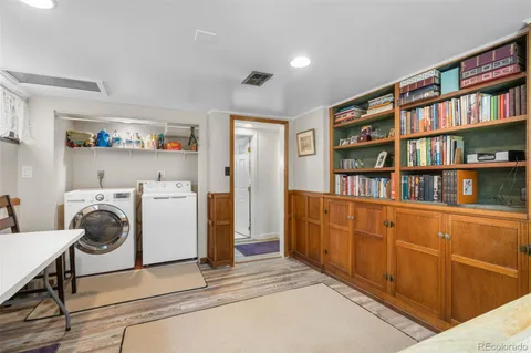 a room with a bookshelf and a window
