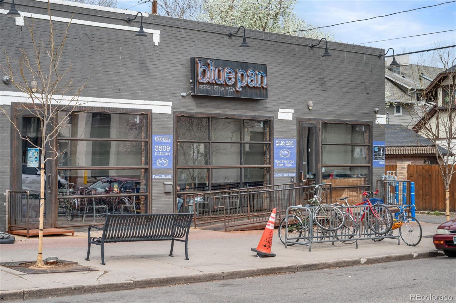 1136 Cook Street Denver, CO 80206 - Photo 34 of 42 a building with table and chairs