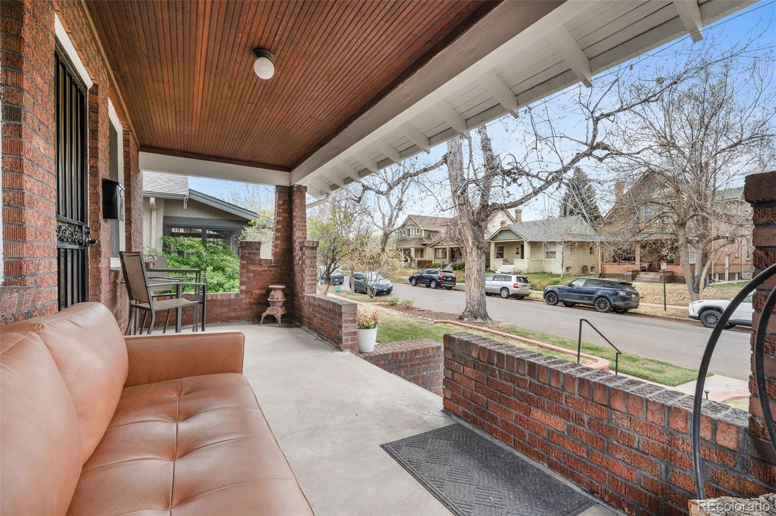 1136 Cook Street Denver, CO 80206 - Photo 5 of 42 a living room with furniture and a large window