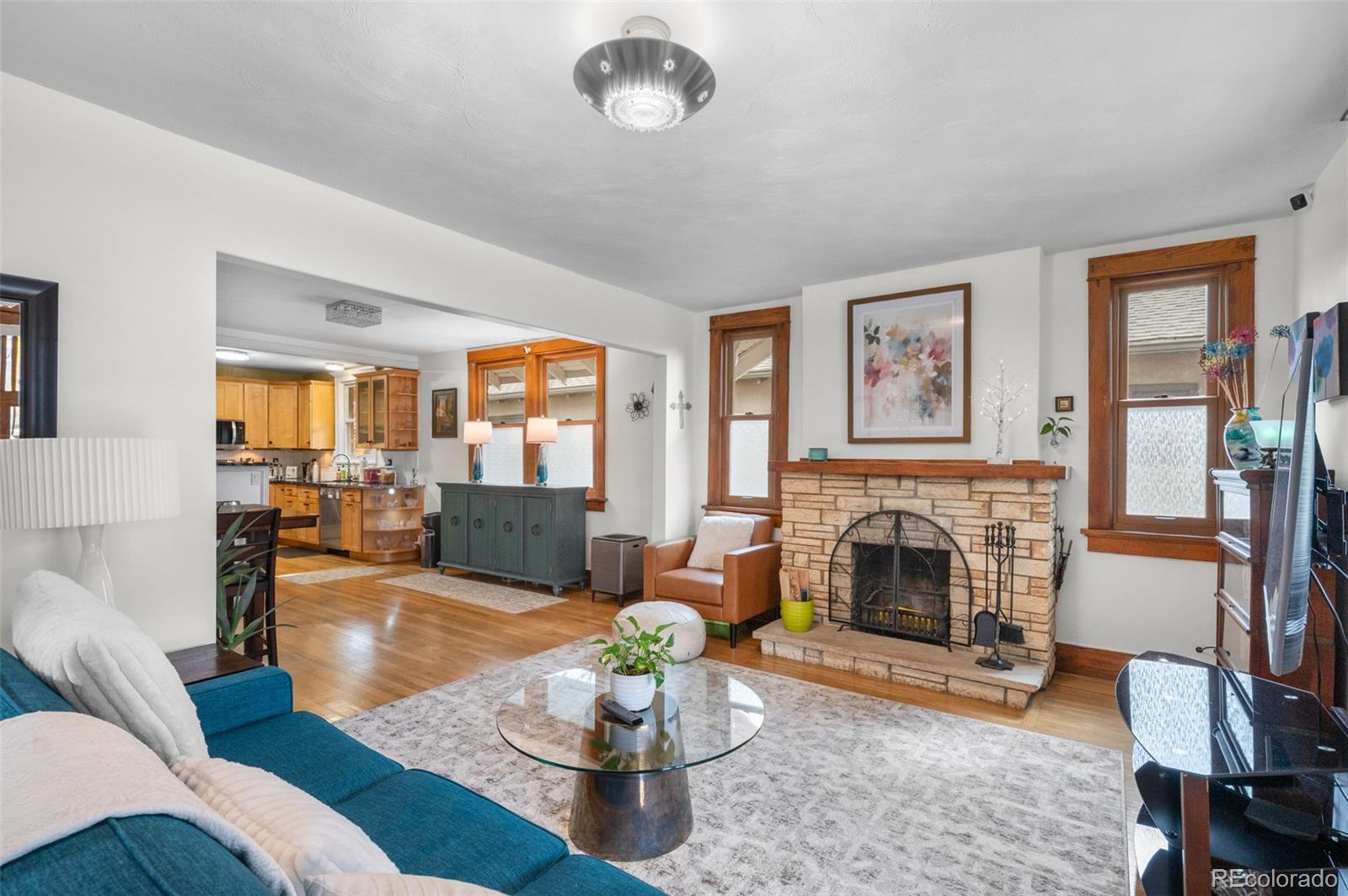 1136 Cook Street Denver, CO 80206 - Photo 6 of 42 a living room with furniture and a fireplace