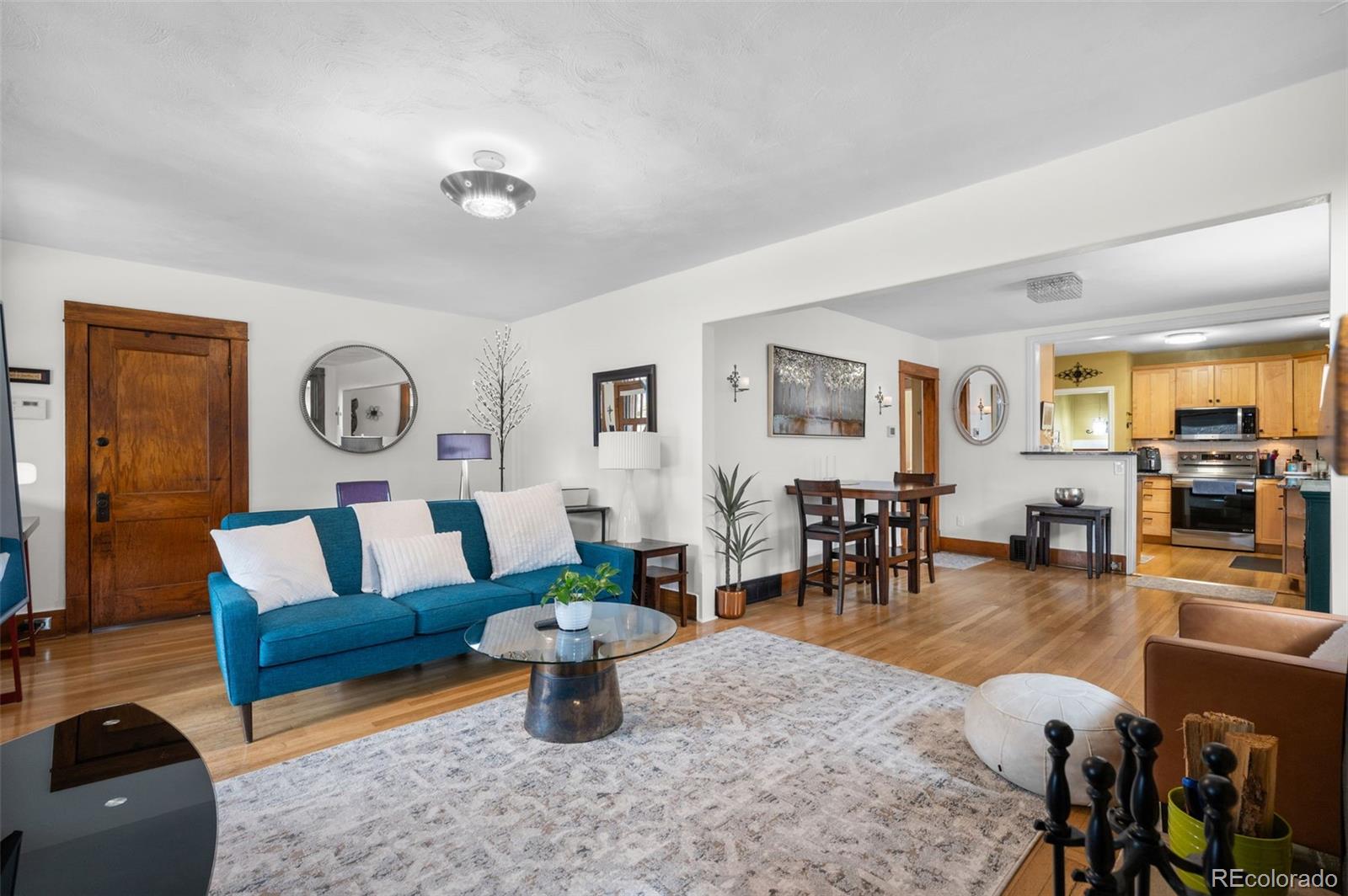 1136 Cook Street Denver, CO 80206 - Photo 10 of 42 a living room with furniture and wooden floor