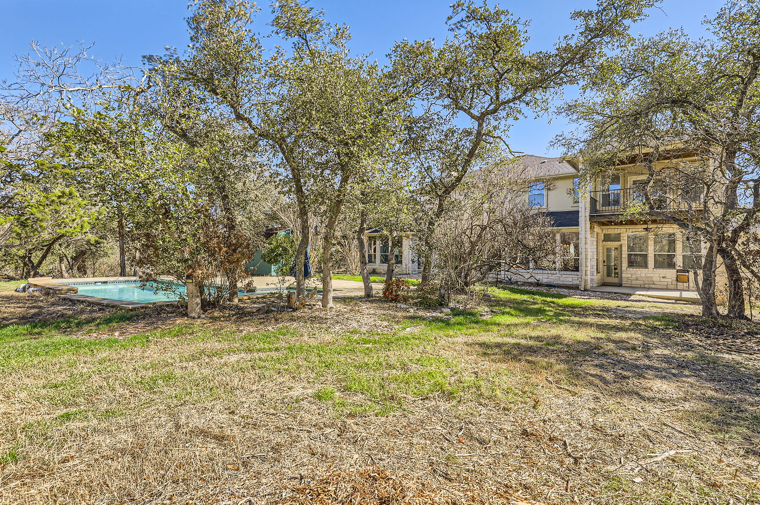 210 Amandas Way Leander, TX 78641 - Photo 9 of 38 View of yard featuring a balcony, a patio area, and an outdoor pool