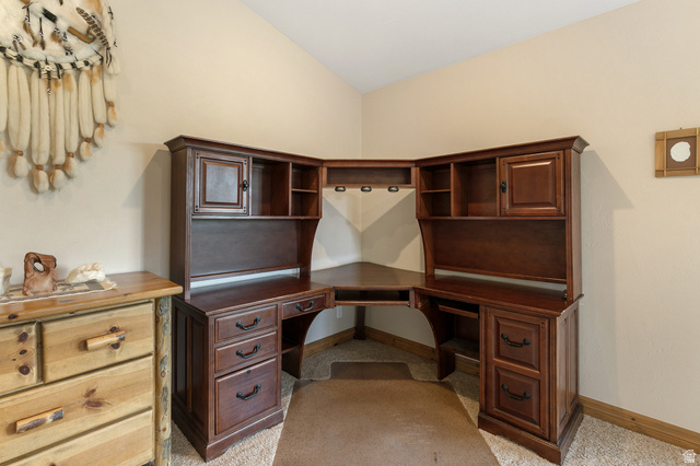 755 South Zion Ridge Drive Orderville, UT 84758 - Photo 77 of 84 Office with vaulted ceiling, built in desk, and light carpet