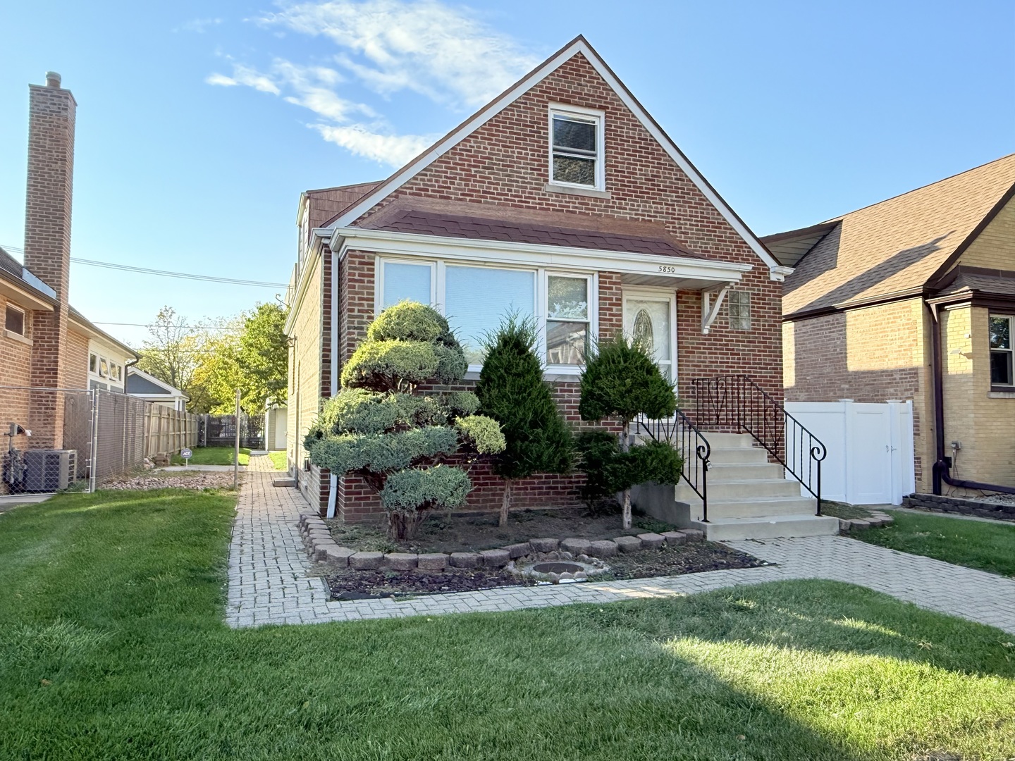 5850 South Neva Avenue Chicago, IL 60638 - Photo 1 of 17 a front view of a house with a yard