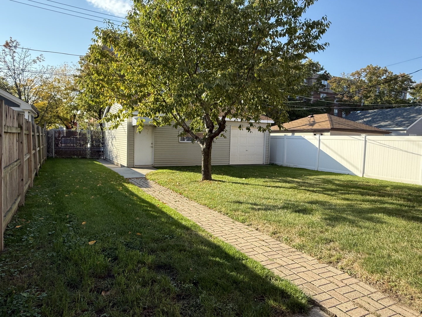 5850 South Neva Avenue Chicago, IL 60638 - Photo 16 of 17 a view of a house with a yard and tree