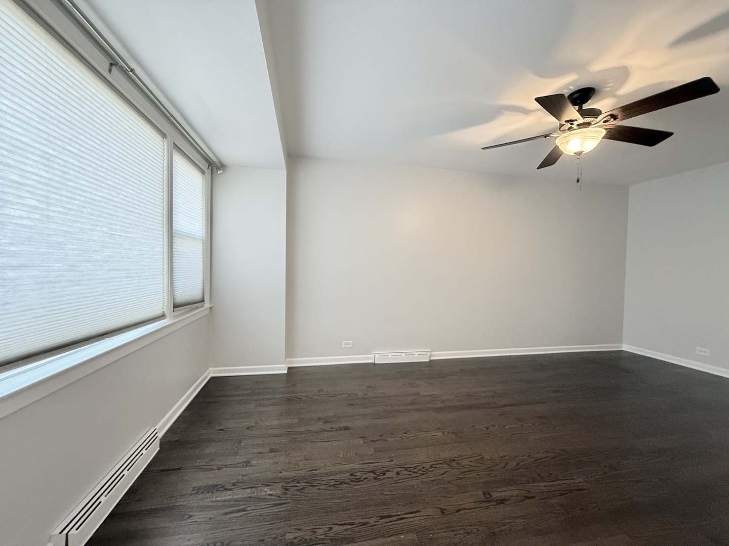 5850 South Neva Avenue Chicago, IL 60638 - Photo 3 of 17 a view of an empty room with wooden floor and a window