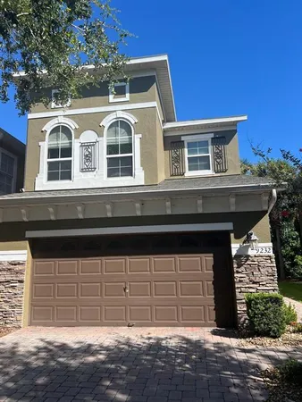 a front view of a house with a garage