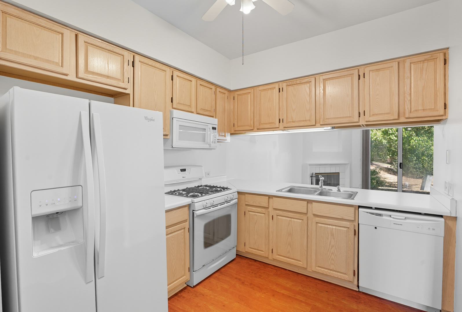 519 Woodcrest Drive, Unit 519 Mundelein, IL 60060 - Photo 6 of 21 a kitchen with cabinets appliances a sink and a window