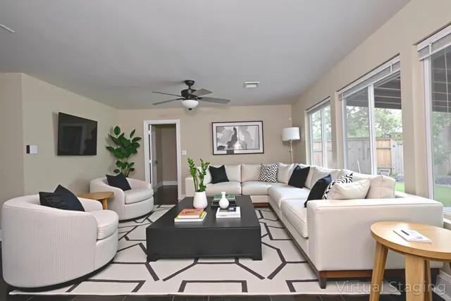 a living room with furniture and a large window