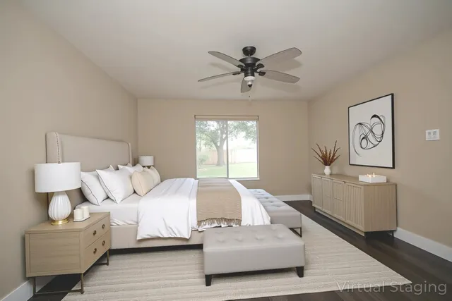 a bedroom with a white bed and white walls