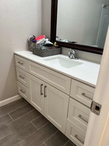 a white toilet sitting next to a shower