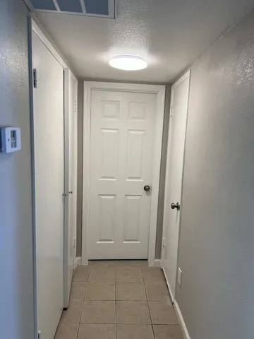 a view of an empty room with a window