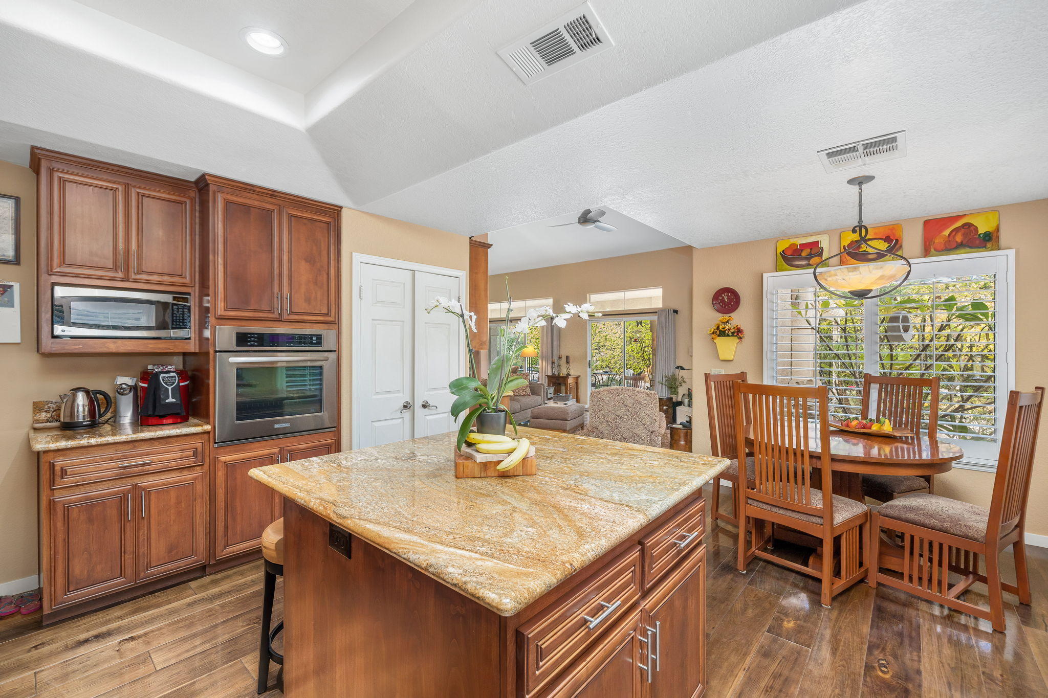 36605 Palmdale Road Rancho Mirage, CA 92270 - Photo 22 of 63 a kitchen with stainless steel appliances granite countertop a stove and cabinets