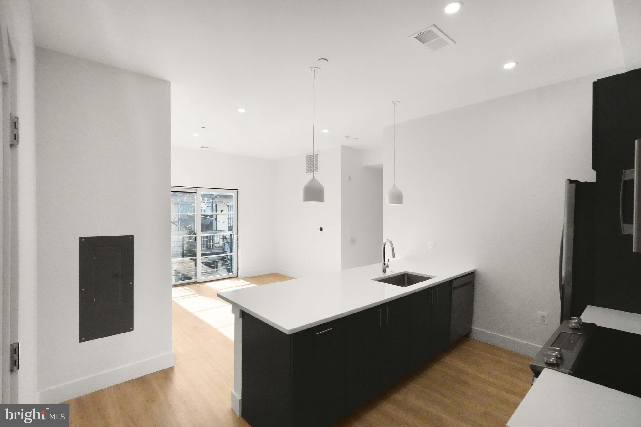 Open Concept Living/Dining Room w/ Quartz Island