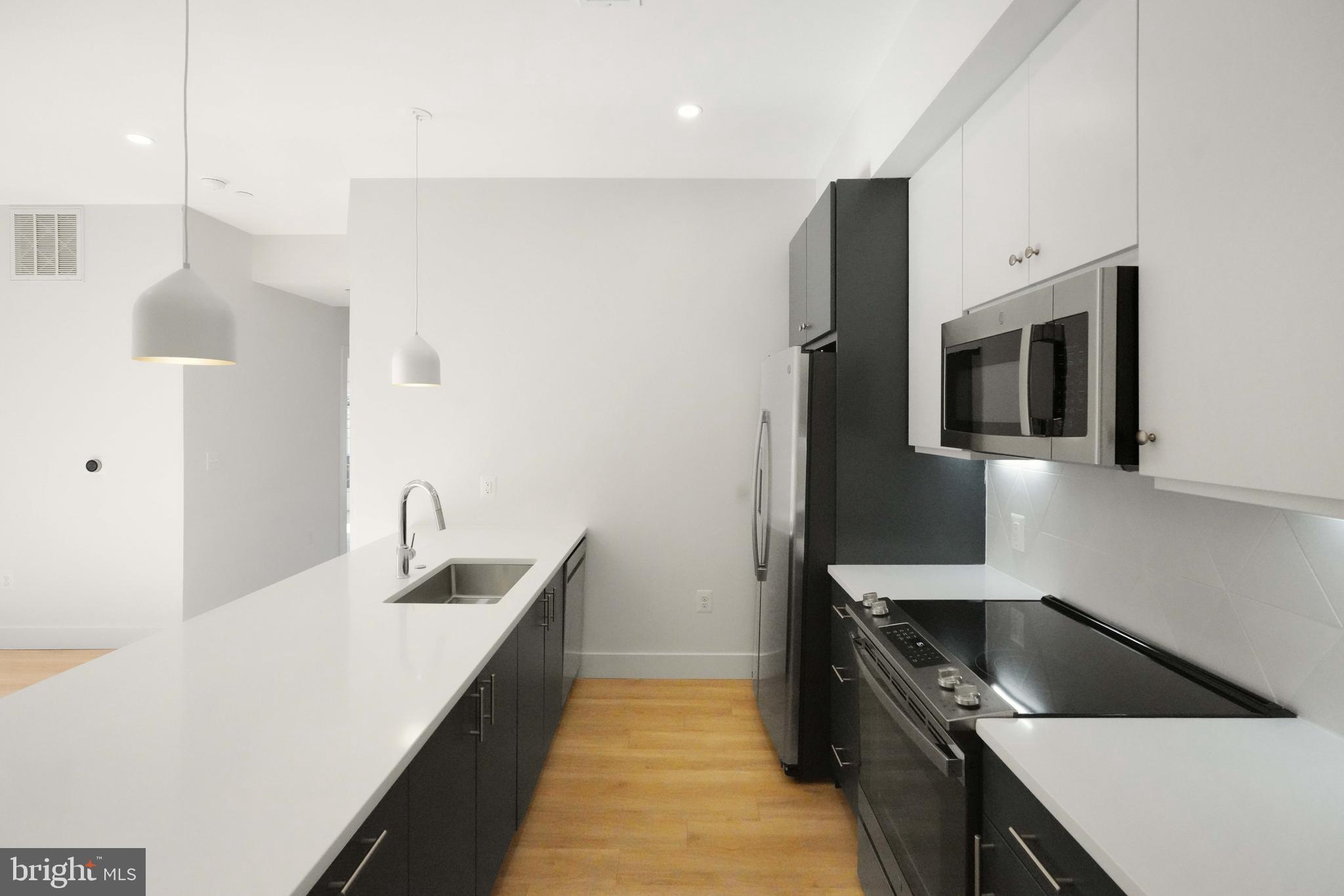 2310 4th Street Northeast, Unit 14 Washington, DC 20002 - Photo 2 of 32 Stunning Kitchen with Quartz Island & Counters