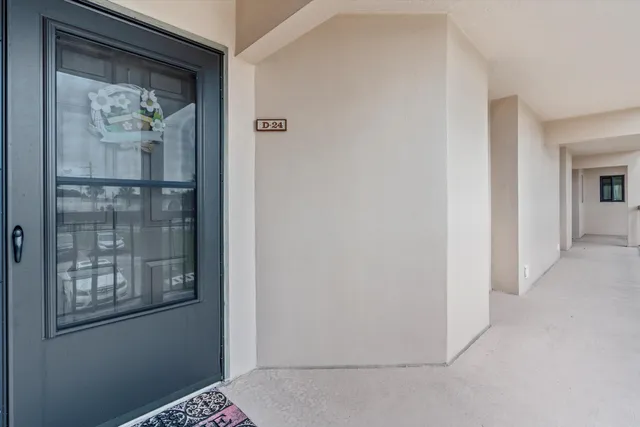 a kitchen with stainless steel appliances granite countertop a refrigerator a stove and a sink