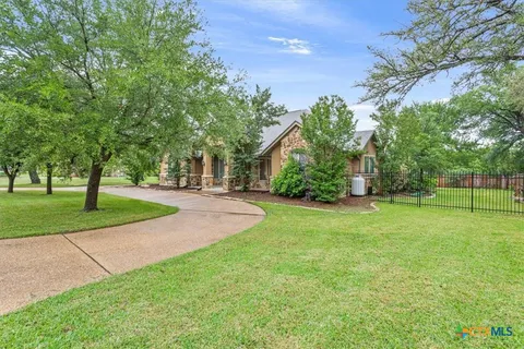 a house with trees in the background