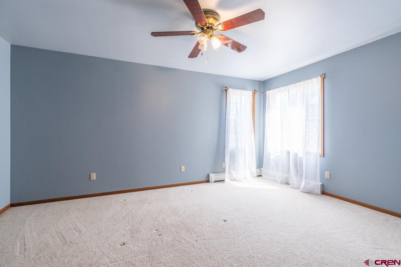 37480 Highway 50, Unit 2 Gunnison, CO 81230 - Photo 18 of 27 an empty room with a window and a fan