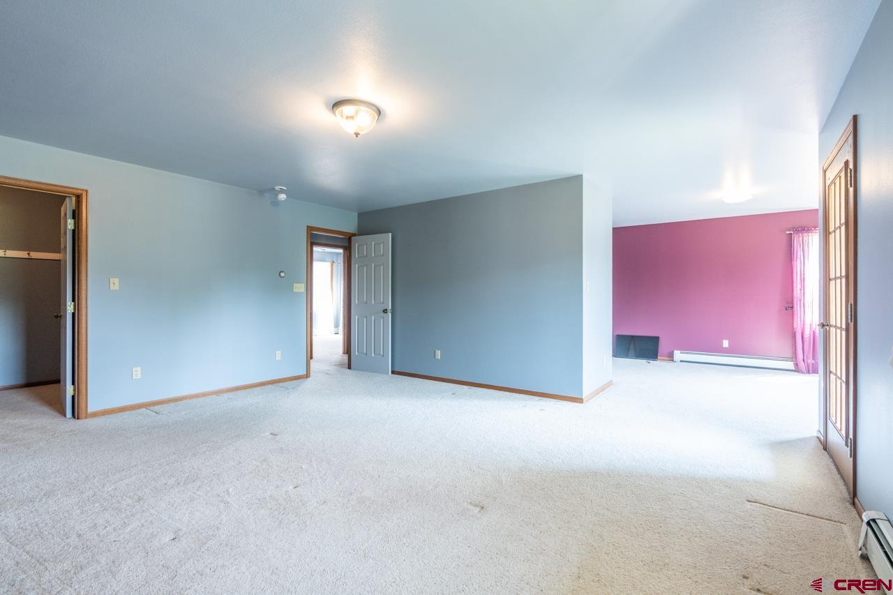 37480 Highway 50, Unit 2 Gunnison, CO 81230 - Photo 21 of 27 an empty room with windows