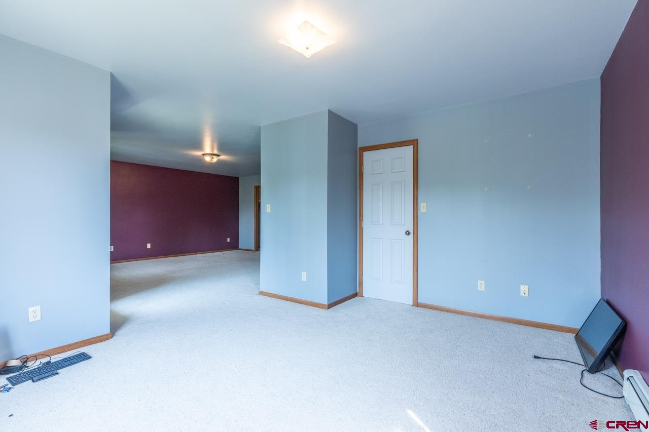 37480 Highway 50, Unit 2 Gunnison, CO 81230 - Photo 22 of 27 an empty room with closet and mirrors