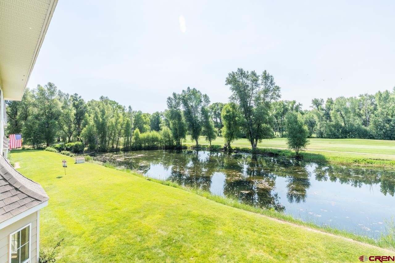 37480 Highway 50, Unit 2 Gunnison, CO 81230 - Photo 24 of 27 a view of a swimming pool with a patio and a yard