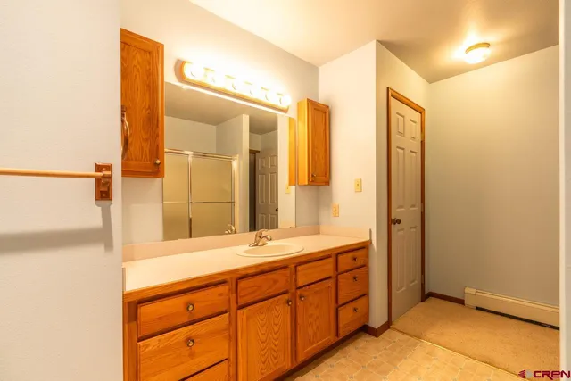a bathroom with a double vanity sink mirror and double