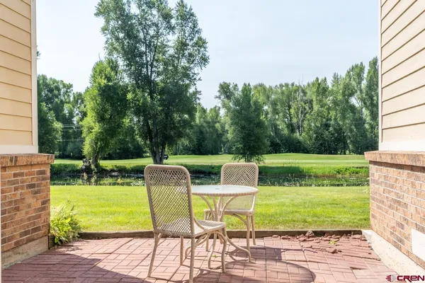 a view of yard with seating area and green space