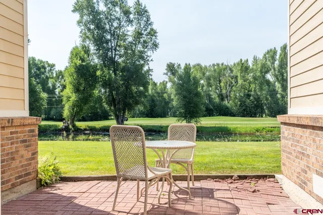 a view of yard with seating area and green space